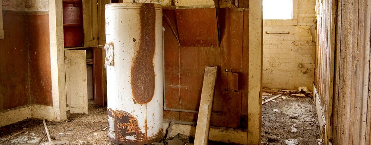 Old water heater in a dilapidated house
