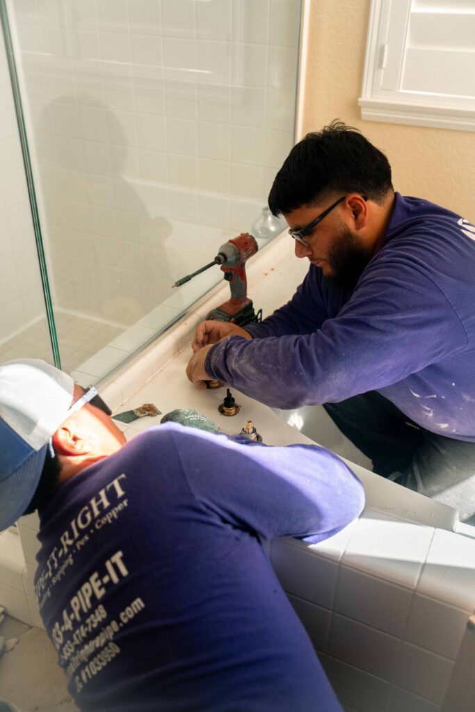 Pipe It Right plumbers replacing a bath tub fixture