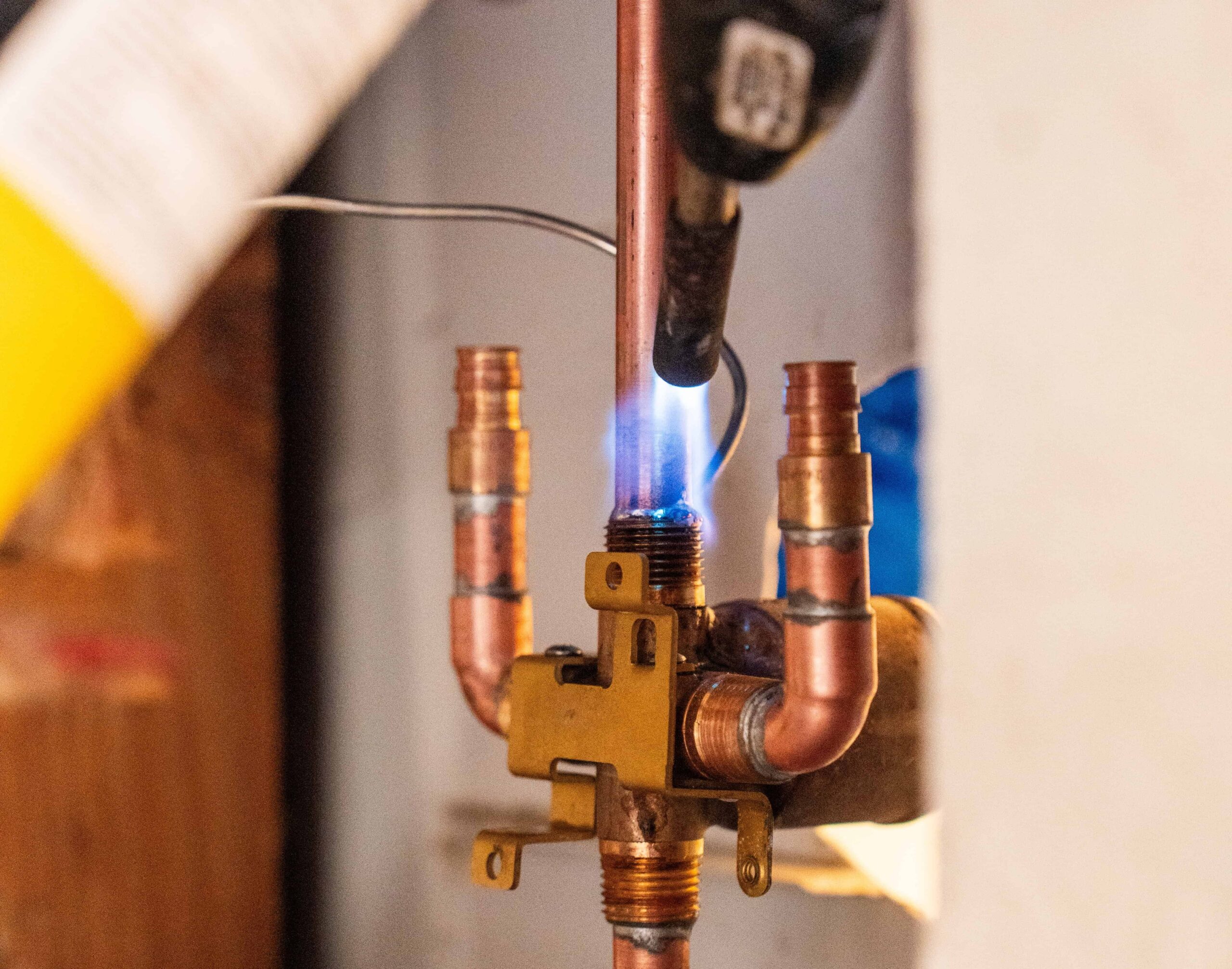Copper piping system being soldered into place