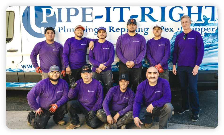 Pipe It Right plumbing team standing together in front of their service van