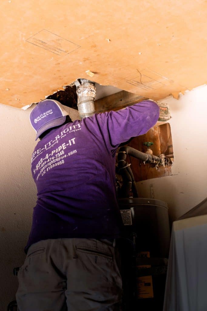 Plumber replacing old pipes for a repiping