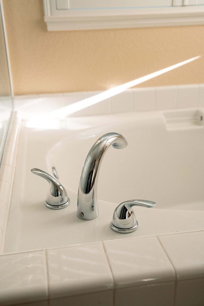 newly installed bath tub spout with valve